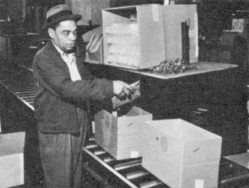 Workshops For The Blind Worker Loading Sanitation Kit Boxes With Supplies